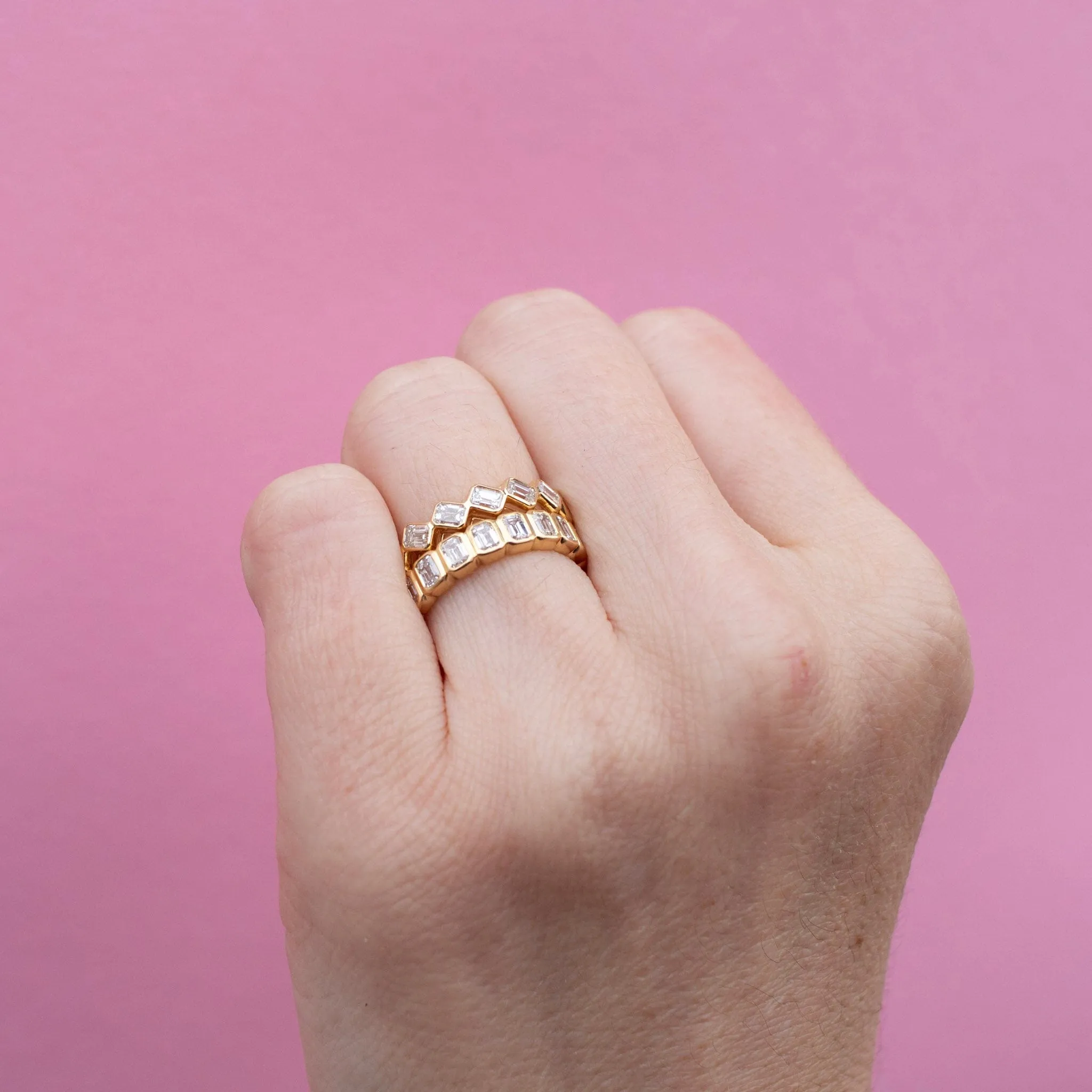 Emerald cut bezel set eternity band